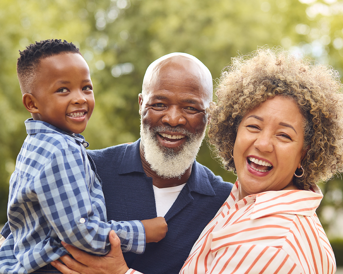 Portrait Of Loving Grandparents Hugging Grandson Portrait Of Loving Grandparents Hugging Grandson